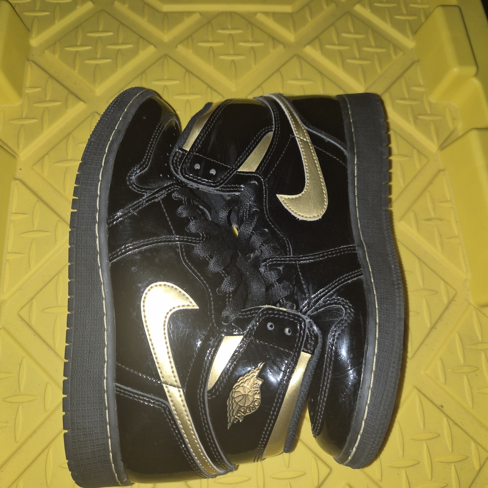 Jordan Black and Gold Sneakers